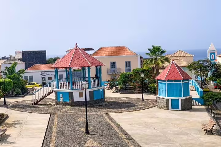 Charming São Filipe town square with traditional gazebo and ocean views, ideal for historic walking tours.