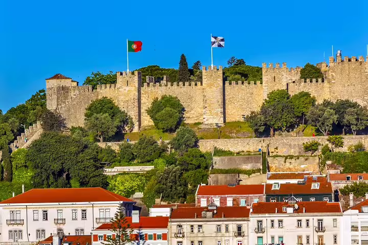 Majestic São Jorge Castle overlooking Lisbon's rooftops, a highlight of the 7-day private tour of Portugal from Lisbon.