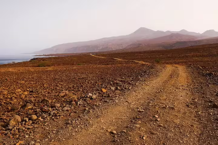 Rocky trail leading to mountainous landscapes along the scenic hiking route in São Nicolau, Cape Verde.