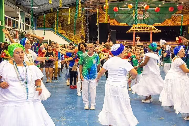 Participants joyfully engage in a vibrant São Paulo Carnaval rehearsal, showcasing traditional samba dance and music.