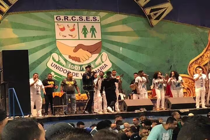 Performers on stage at São Paulo Carnaval rehearsal, showcasing samba music and cultural celebration.