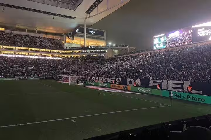 Vibrant crowd fills São Paulo's stadium for an exciting night football match experience.