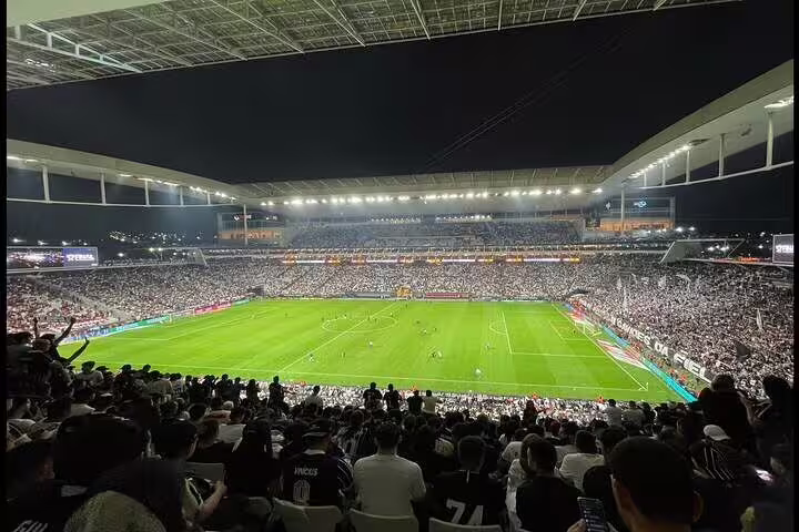 Vibrant night view of São Paulo's stadium packed with fans during an exhilarating live football match experience.