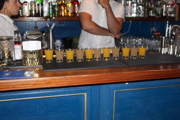 A vibrant bar scene in São Paulo with colorful shots lined up, perfect for a lively pub crawl experience.