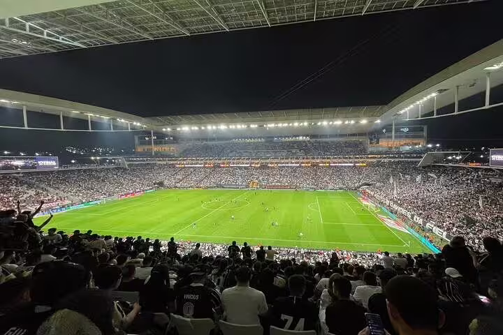 Panoramic view of São Paulo's stadium packed with fans during an electrifying football game.
