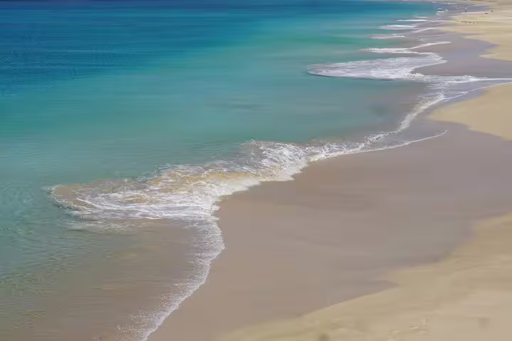 Turquoise beach coastline in São Vicente near Lazareto, Cabo Verde, after smooth private airport transfer