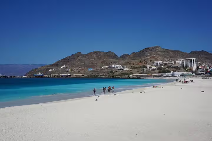 Baía das Gatas beach on São Vicente with turquoise water and mountains, private airport transfer destination view