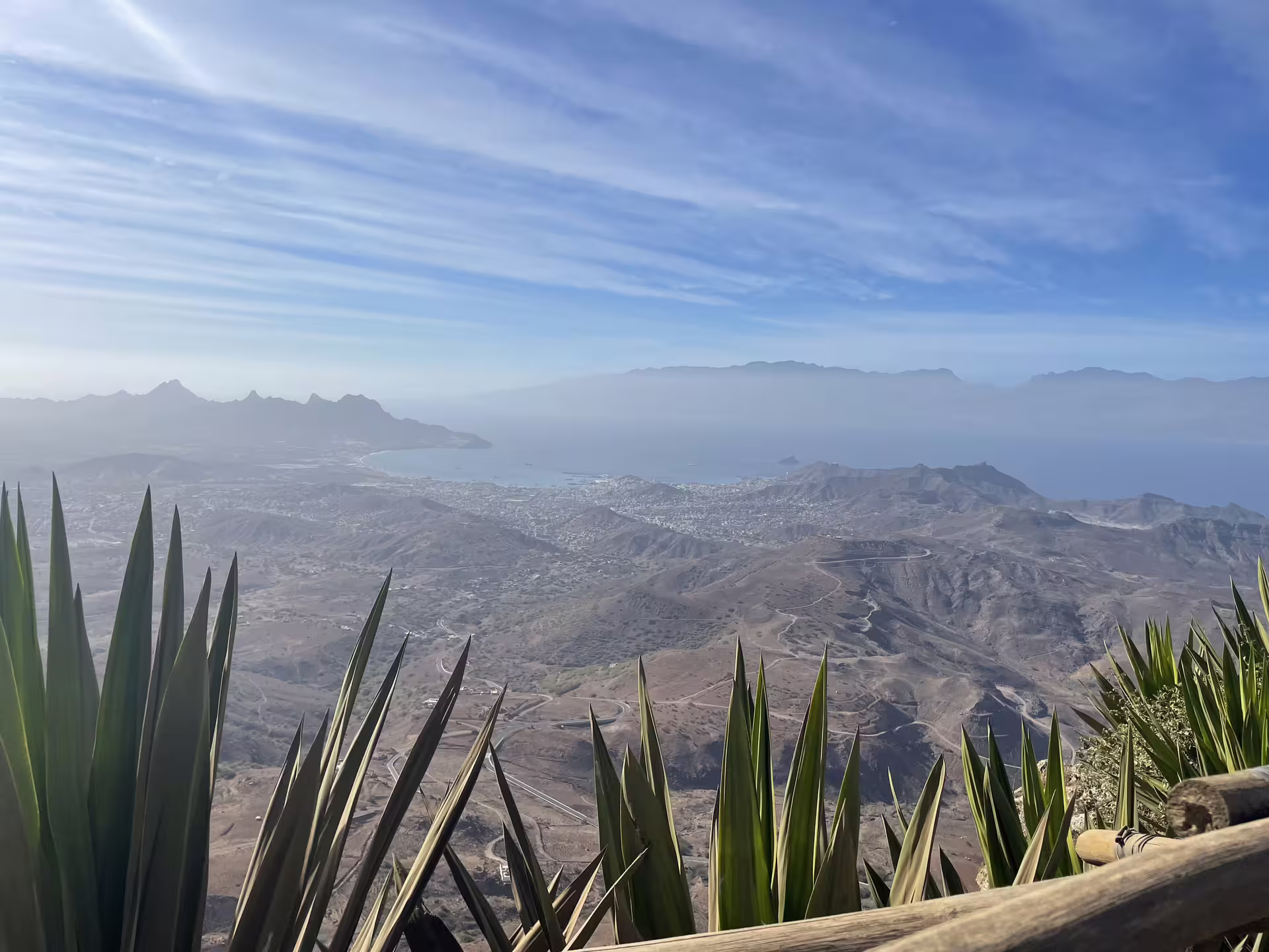Scenic view of São Vicente's rugged landscape and Mindelo bay under a clear blue sky, perfect for a half-day tour.