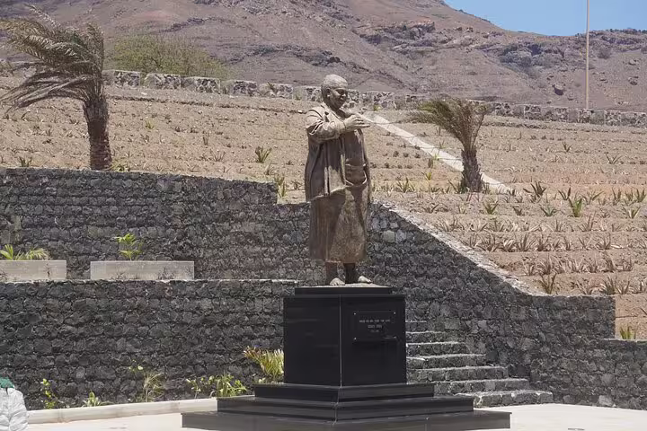 Stone statue monument on São Vicente, a scenic stop on private airport transfer route to São Pedro, Cape Verde