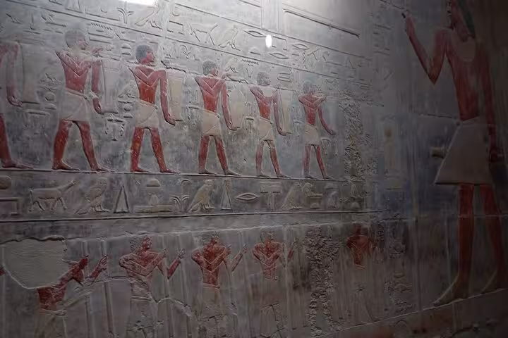 Ancient Egyptian tomb wall reliefs with hieroglyphs at Saqqara, highlight of Memphis and Dahshur tour with lunch