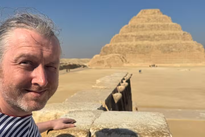 Close-up traveler with Saqqara Step Pyramid backdrop, private Cairo tour to Memphis and Dahshur Red Pyramid