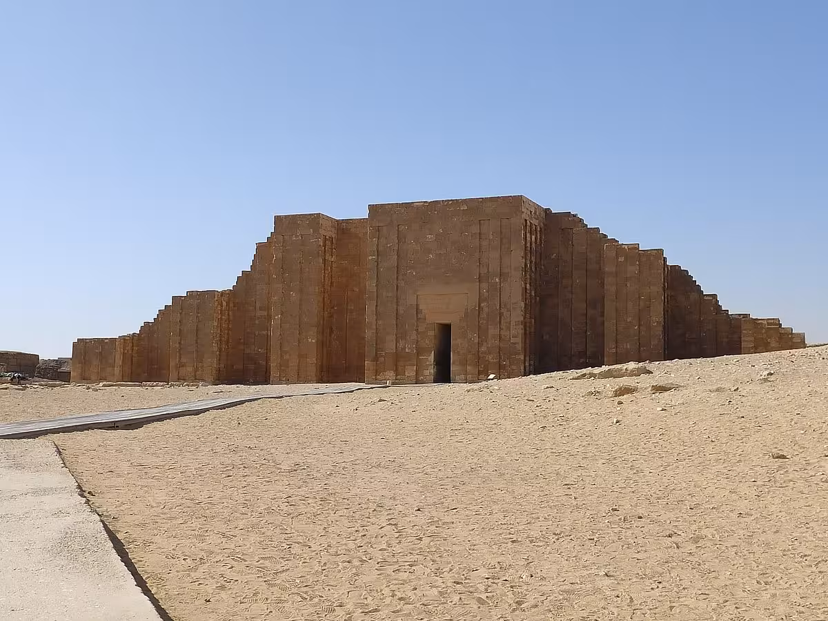 Entrance to the Saqqara Step Pyramid complex in desert sands, included in half-day Memphis Sakkara Dahshur tour