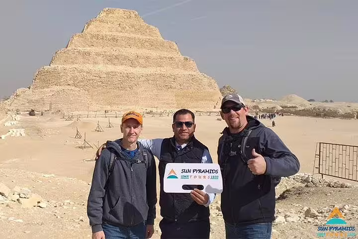 Tourists with guide at Saqqara Step Pyramid on Giza, Memphis and Dahshur pyramids day tour from Cairo