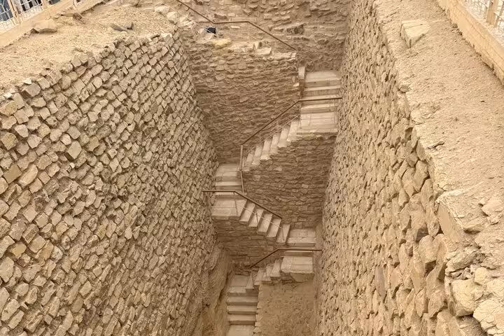 Descend into Saqqara tomb shaft with stone steps on private tour to Saqqara, Memphis and Dahshur