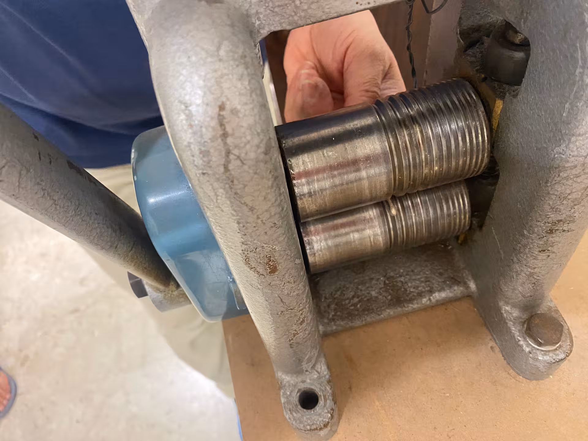 Close-up of a rolling mill used in a Sassari goldsmith workshop, highlighting the intricate jewelry-making process.