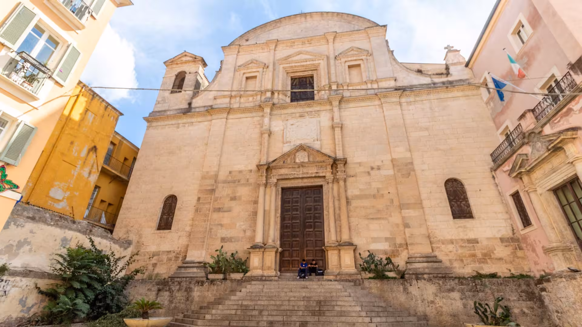 Explore the historic architecture of Sassari's grand cathedral facade on a guided tour of the charming city center.