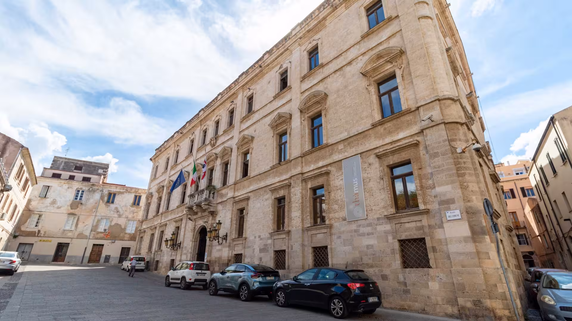 Historic building in Sassari's center, showcasing classic architecture on a sunny day, perfect for cultural tours.
