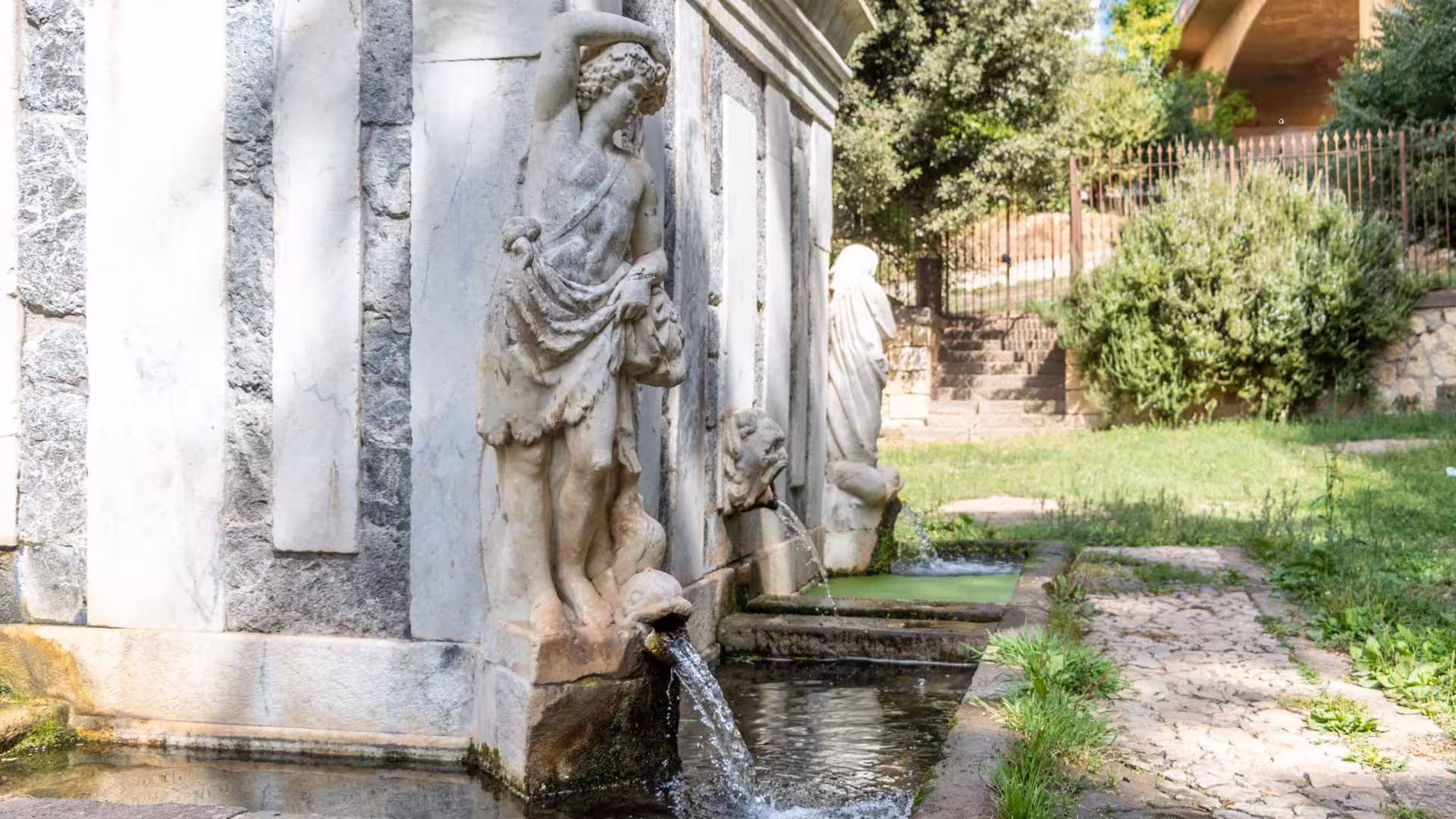 Admire the detailed sculptures and flowing water of an ancient fountain in Sassari's historic center on this tour.