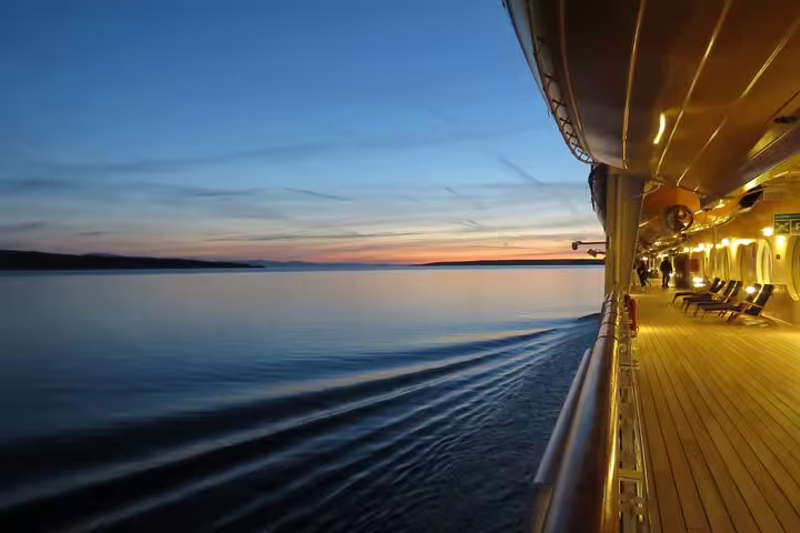 Boat deck at dusk on the Red Sea en route to Satayh Dolphin Reef, relaxing cruise before snorkeling trip
