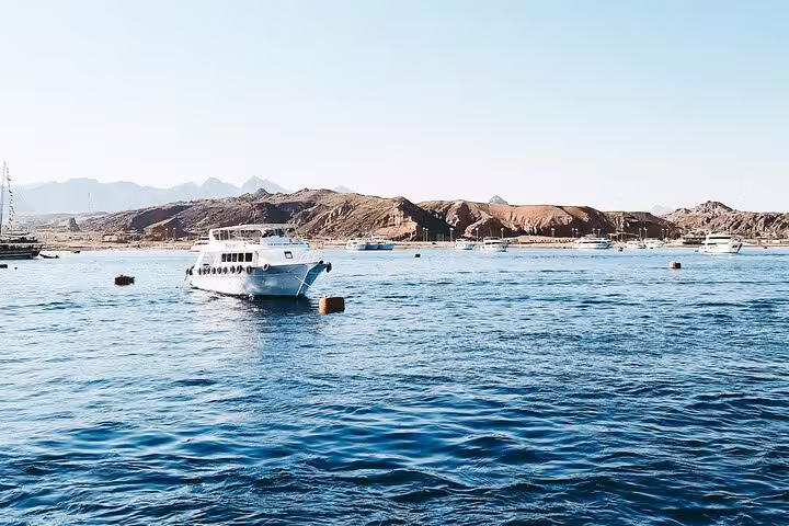 Boat anchored near Satayh Dolphin Reef in Marsa Alam, Red Sea, for snorkeling trip to dolphin lagoon