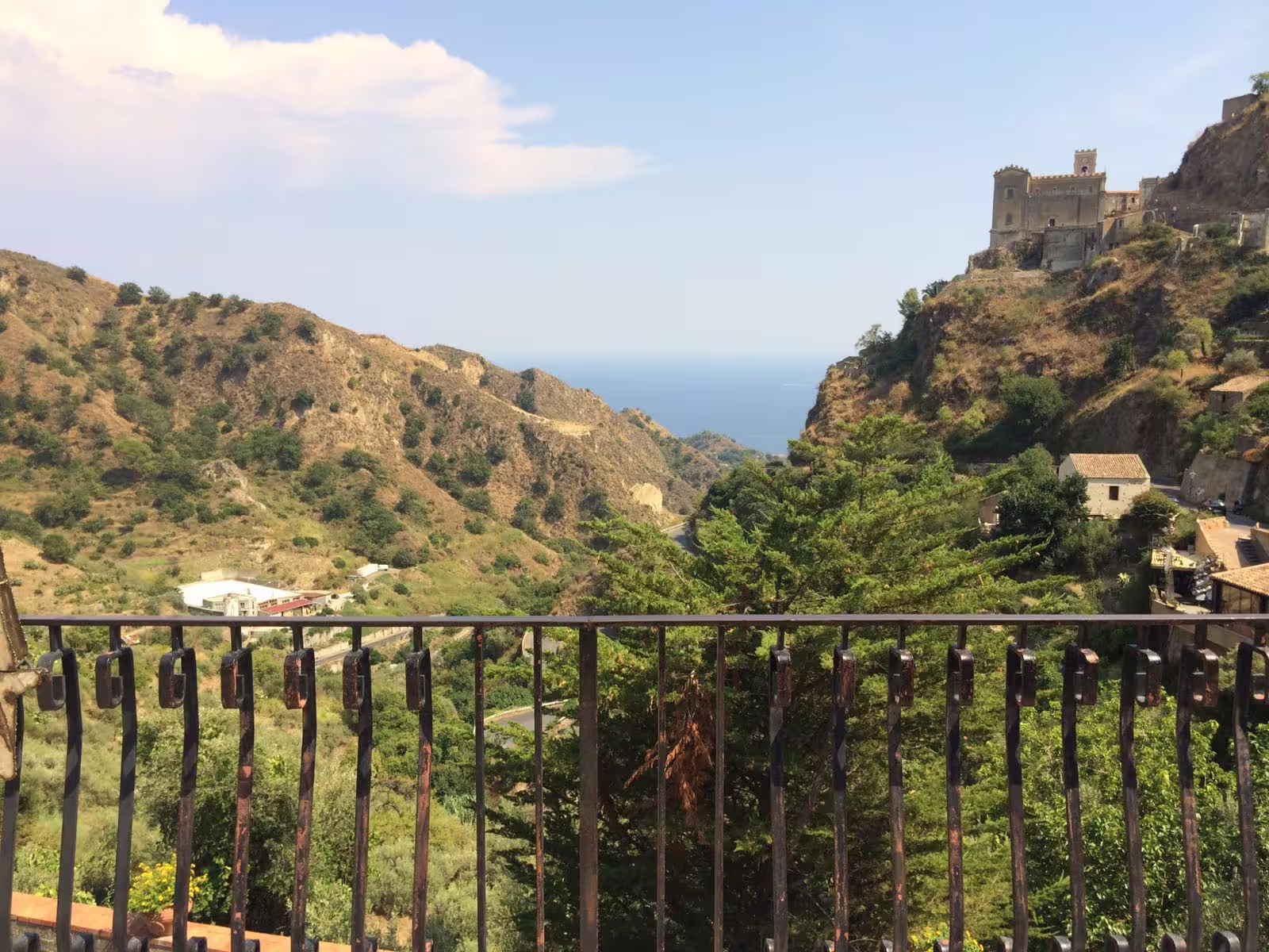 Savoca hilltop view over Sicilian valleys and Ionian Sea on Godfather Villages and Taormina tour from Catania