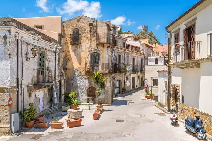 Charming rustic street in Savoca, Sicily, showcasing historic architecture on the Godfather private tour from Messina port.