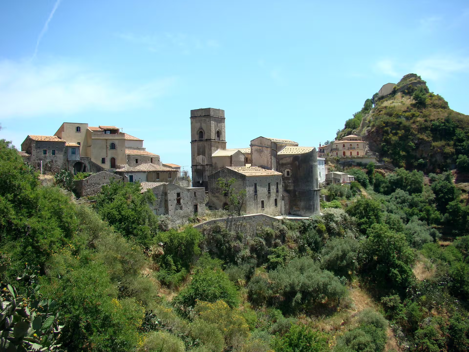 Savoca hilltop village view from Taormina Godfather tour, stone houses and church tower in Sicily