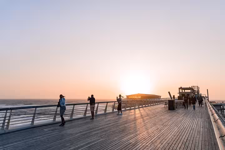 Sunset on Scheveningen Pier in The Hague, scenic stop after Amsterdam or Schiphol Airport private transfer