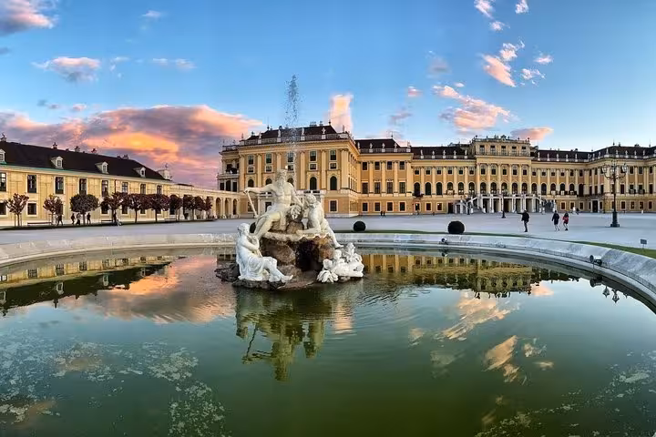 Schonbrunn Palace fountain in Vienna at sunset, scenic stop on Budapest to Vienna private transfer via Parndorf