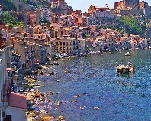 Colorful seaside houses and medieval castle above the Tyrrhenian Sea in Scilla, iconic stop on a Fabulous Calabria tour