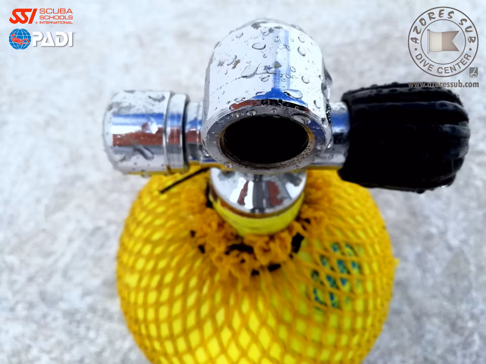 Scuba tank valve and regulator connection with water droplets, gear setup for equipment techniques specialty