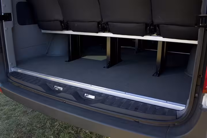 Spacious van interior showcasing ample luggage storage for airport transfer services in Rio de Janeiro.