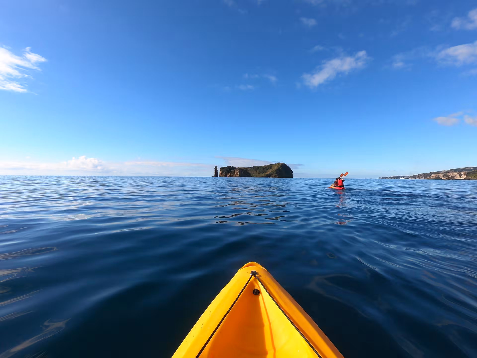 Sea kayaking tour to Vila Franca do Campo Islet, São Miguel Azores, calm Atlantic waters and blue sky