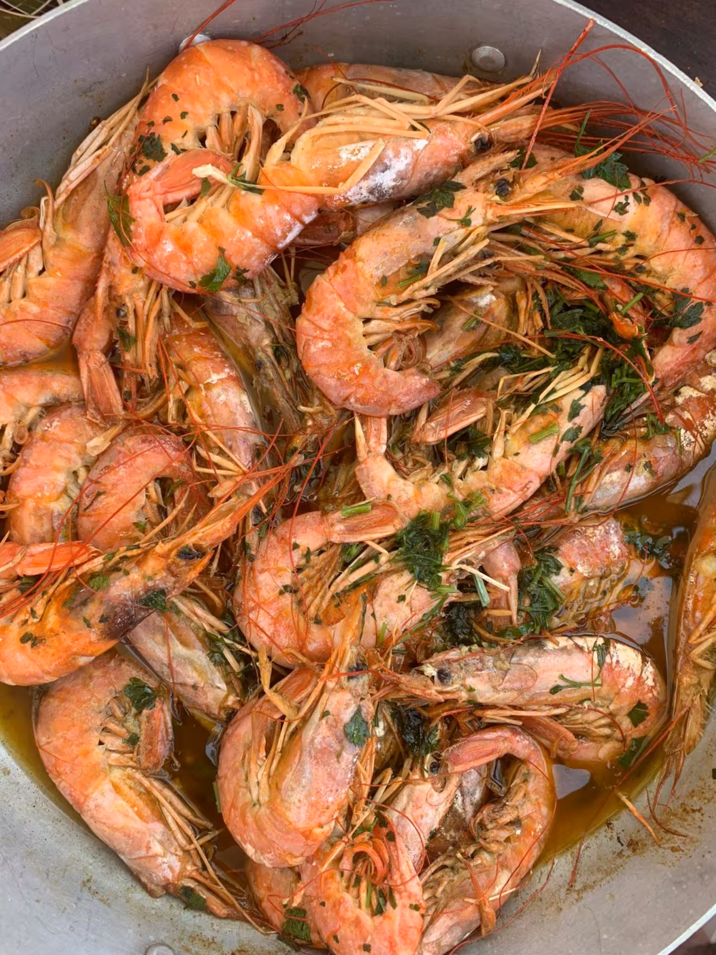 Deliciously seasoned prawns in a bowl, highlighting local cuisine on the La Maddalena Archipelago speedboat tour.