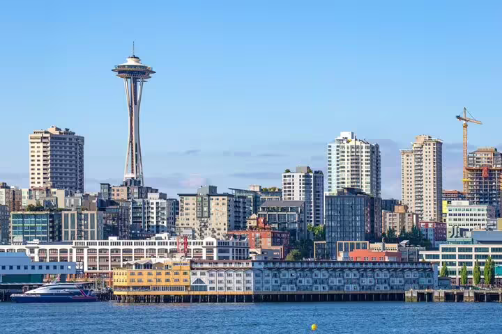 Seattle skyline with iconic Space Needle tower and waterfront piers viewed from Elliott Bay
