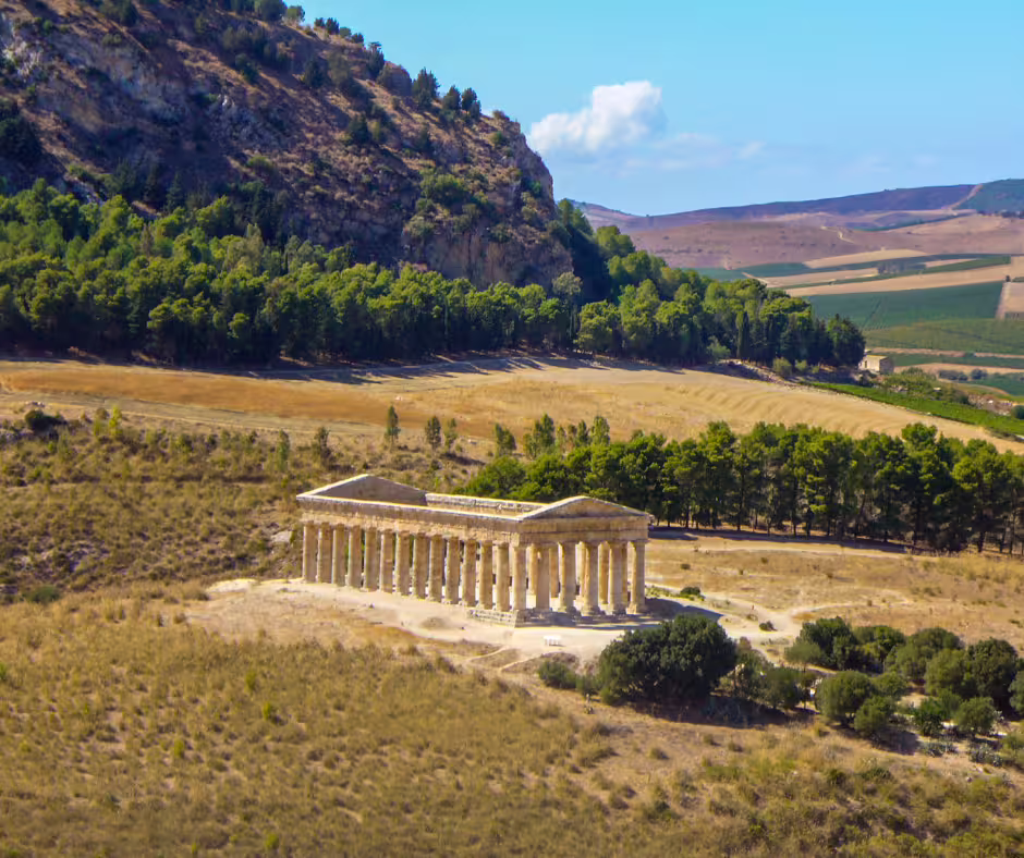Aerial view of the isolated Segesta temple amid rolling Sicilian hills on a private excursion from Palermo