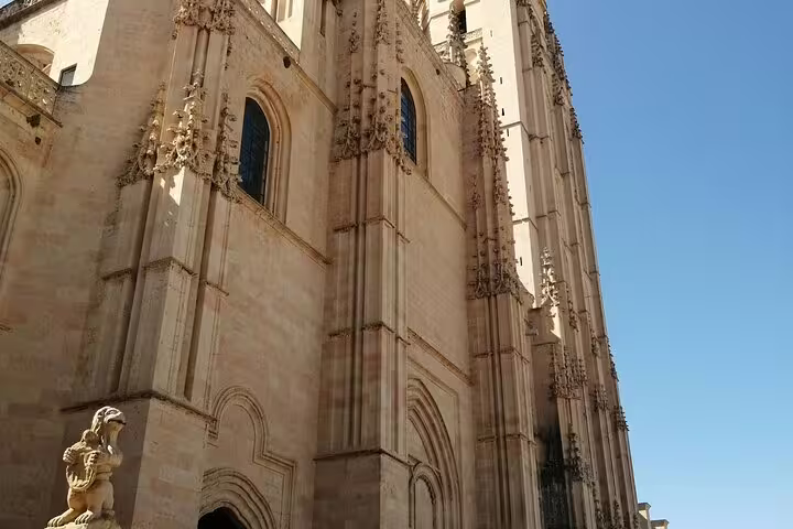 Gothic facade of Segovia Cathedral in sunlight on a half-day private Segovia tour by minivan