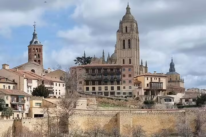 Segovia Cathedral skyline over historic old town, highlight of private minivan tour with El Escorial and Segovia