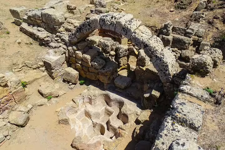 Ancient stone ruins and archway at the Archaeological Park of Selinunte, Sicily, visited on a private tour from Palermo