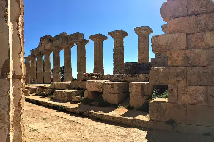 Sunlit Doric temple ruins at the Archaeological Park of Selinunte on a private tour from Palermo in Sicily, Italy