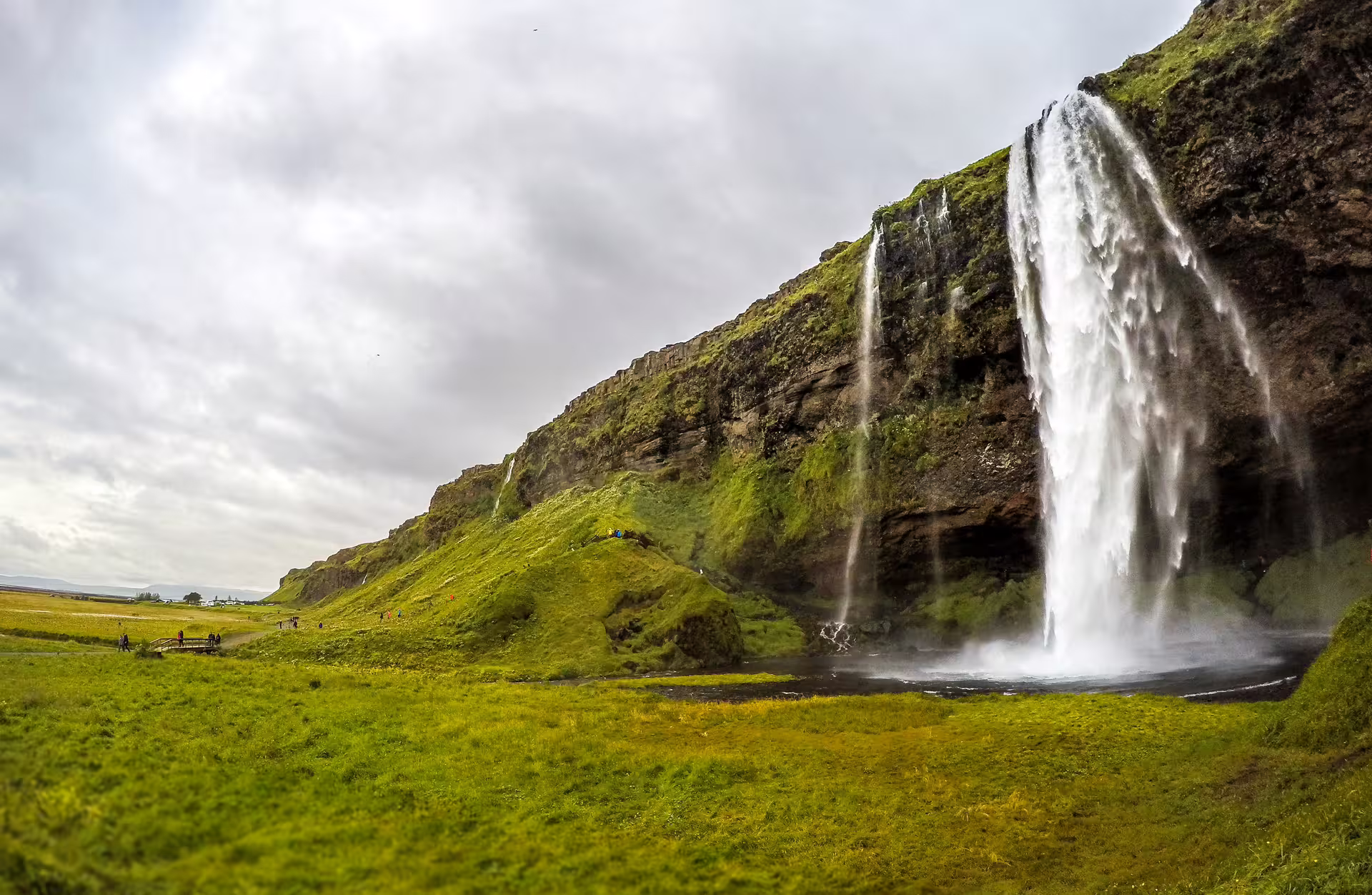 Majestic Seljalandsfoss waterfall cascading over green cliffs on a private South Coast Iceland day trip