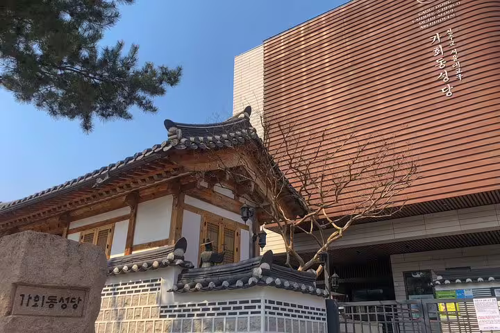 Traditional Korean hanok building beside modern architecture in Seoul's Gahoe-dong neighborhood
