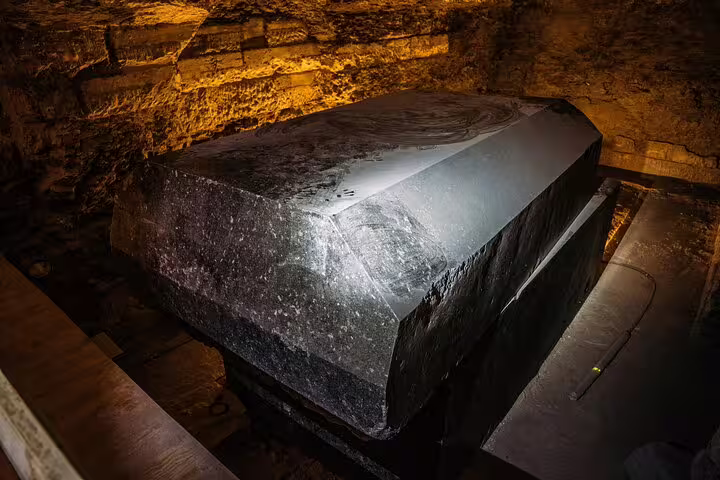 Inside Serapeum of Saqqara with massive granite sarcophagus, Memphis and pyramids day trip from Cairo