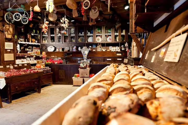 Cozy Portuguese shop in Serra da Estrela featuring traditional breads and local delicacies on a private day tour.
