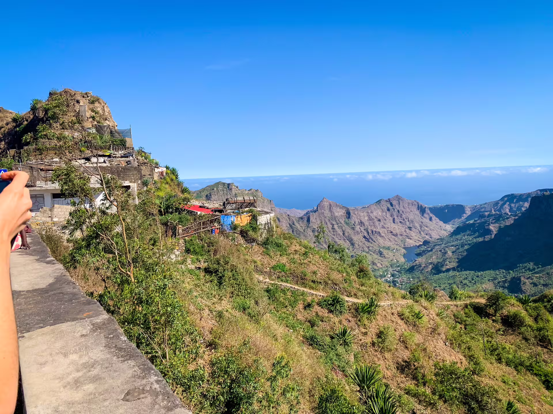 Scenic view of Serra Malagueta Natural Park with rugged mountains and lush greenery under a clear blue sky.