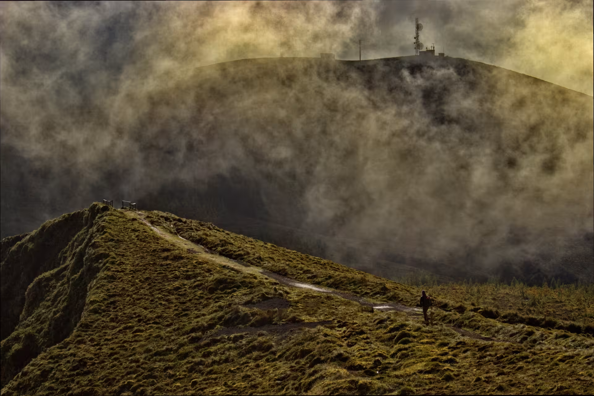 Misty ridge trail on São Miguel, Azores, Seven Cities to Ferraria hike, dramatic clouds over volcanic peaks