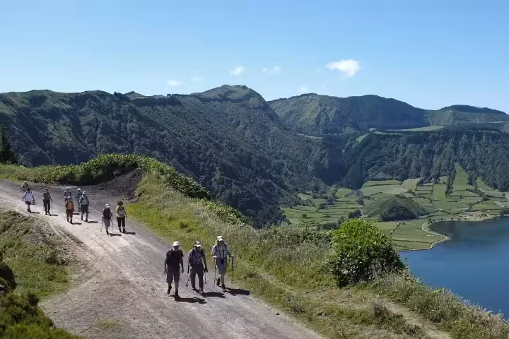 Hikers on a scenic ridge trail above Sete Cidades lagoon, full-day Seven Cities walking tour with lunch