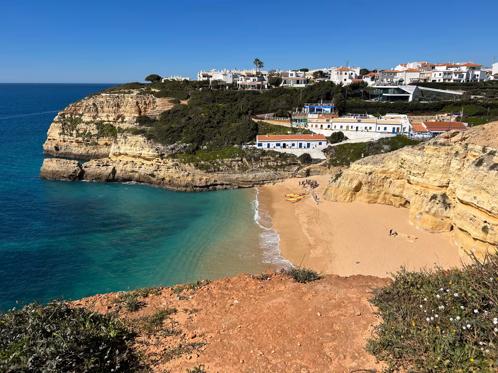 Scenic Algarve coastal beach cove with golden cliffs and turquoise water on the Seven Hanging Valleys guided trail tour