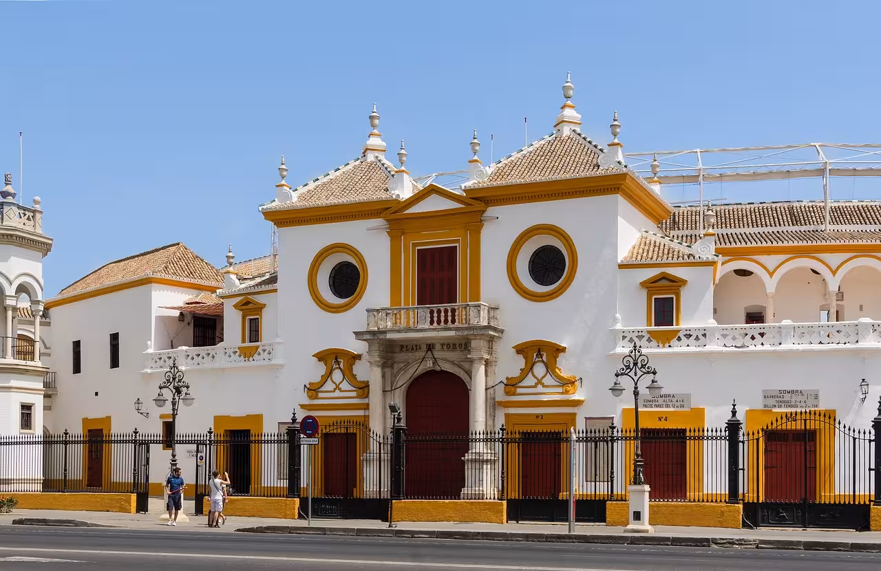 Explore the historic architecture of Plaza de Toros in Sevilla on a vibrant day tour.