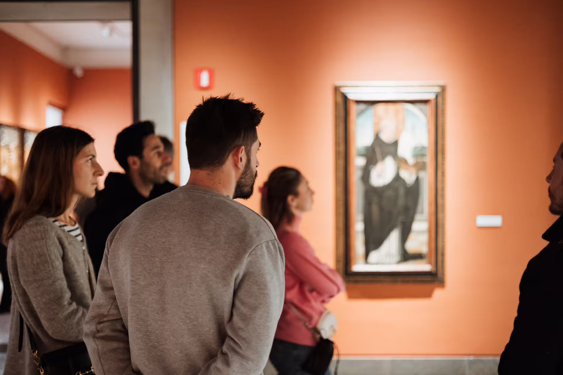 Visitors admire artwork in Seville's Fine Arts Museum, featuring guided tours of Spanish masterpieces and cultural history.